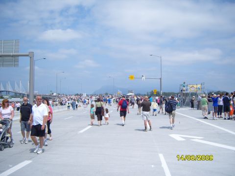 1989 Ford Bronco - A large crowd walks on a highway on June 14, 2009, with a bridge and mountains visible.