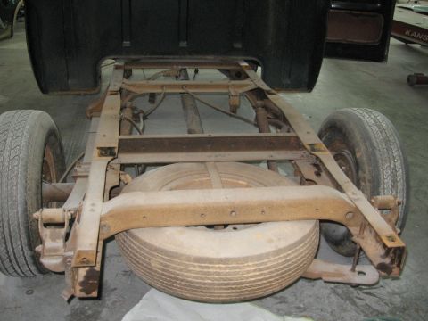1966 Ford F-100 - Truck frame and suspension components, including a spare tire, are visible in this image.