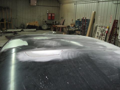 1966 Ford F-100 - The roof of a 1966 Ford F-100 is shown with body filler and primer applied, indicating ongoing body shop repairs.