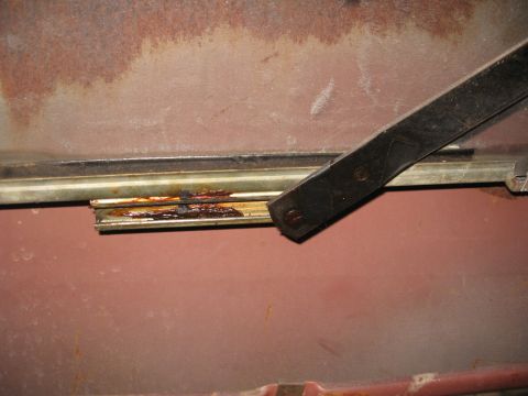 1966 Ford F-100 - There's a bushing there on the end of the regulator arm that rides in that channel. There's a crooked "U" shape clip on it, pull that clip…