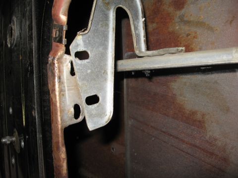 1966 Ford F-100 - I forgot to take a pic before removing these, but there are two bolts holding the division bar to the door.