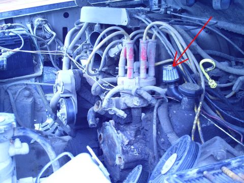 1990 Ford Bronco - Close-up view of an engine bay, showing various components and wiring.