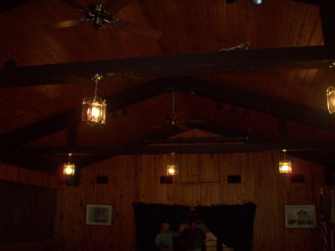 1985 Ford Bronco - The interior of a wooden room, possibly a venue, with decorative lighting and ceiling fans.