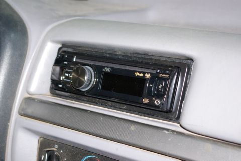 1995 Ford Bronco - Close-up of an aftermarket JVC radio unit installed in a vehicle's dashboard.