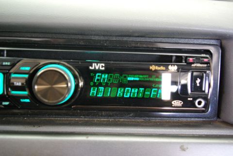 1995 Ford Bronco - Close-up of a car's JVC radio unit, displaying HD Radio information and a USB port.