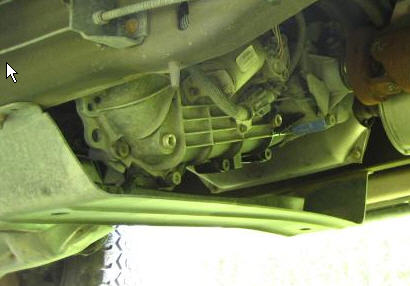 1995 Ford Bronco - Underside view of a vehicle's transfer case and skid plate, with Supermotors.net branding visible.
