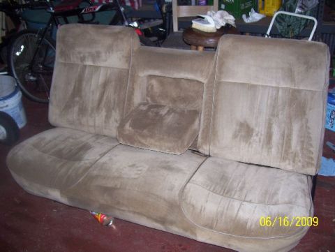1978 Ford Bronco - This is a tan velour car seat with visible stains, viewed from the front.