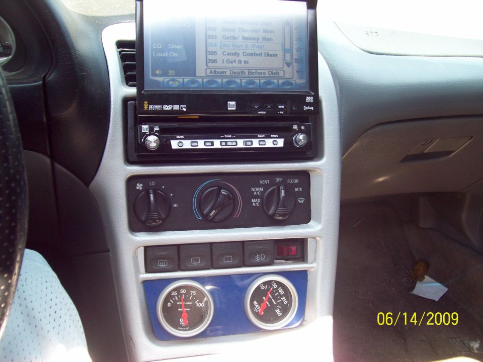 cd player with fold out screen and temp and oil pressure gauges
