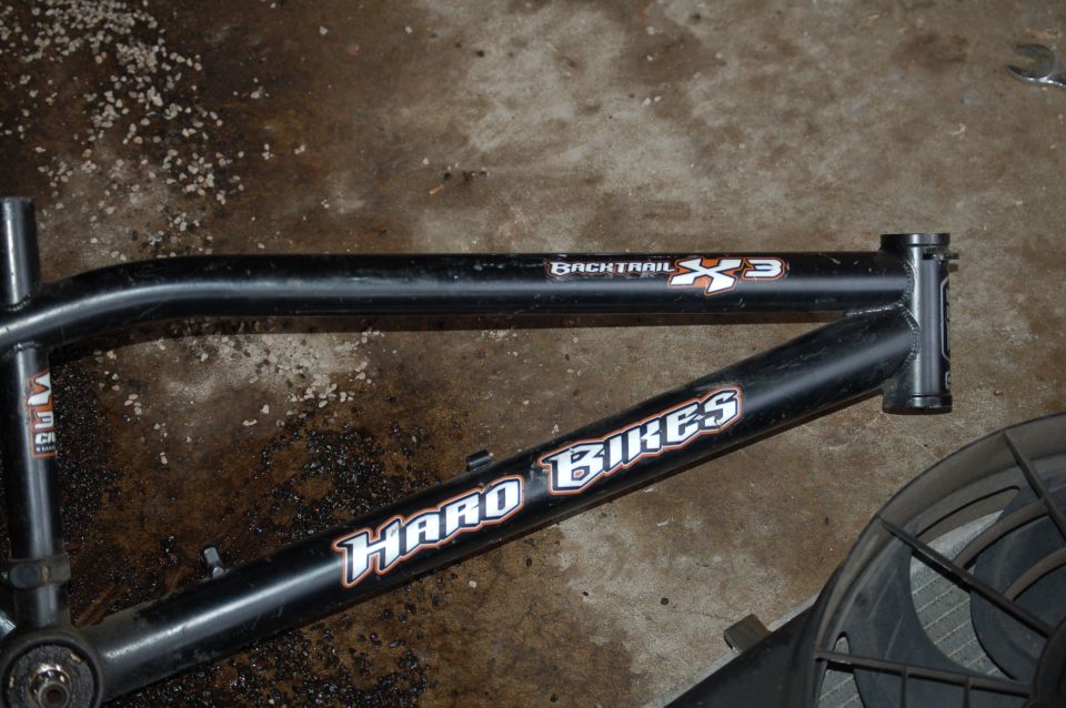 Black bicycle frame with Haro Bikes and Backtrail X3 decals