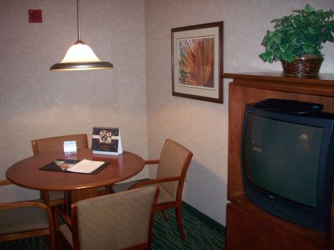 1985 Ford Bronco - Interior view of a hotel room, a dining area and entertainment center.
