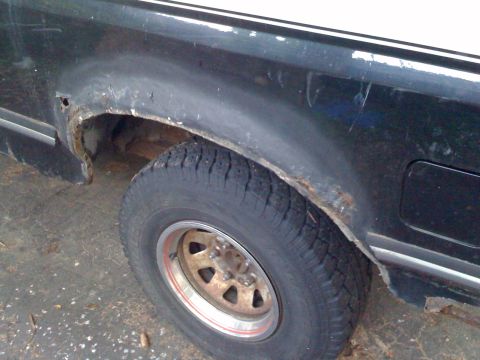 1988 Ford Bronco - Rust is visible around the rear wheel well of this 1988 Ford Bronco.