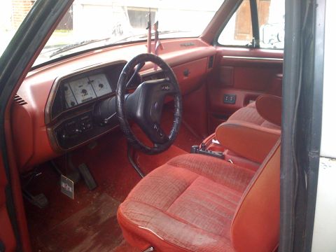 1988 Ford Bronco - Interior view of a 1988 Ford Bronco, showing the dashboard and seats.