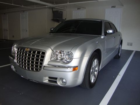 2008 Chrysler 300 - Silver 2005 Chrysler 300 sedan with tinted windows parked in a garage.