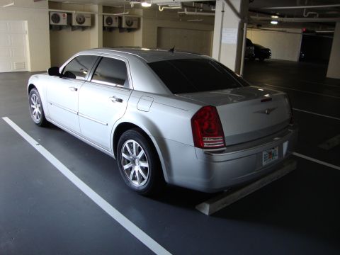 2008 Chrysler 300 - Silver Chrysler 300 sedan with tinted windows parked in a garage.
