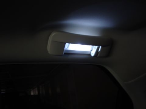 2008 Chrysler 300 - The interior dome light illuminates the car's ceiling.