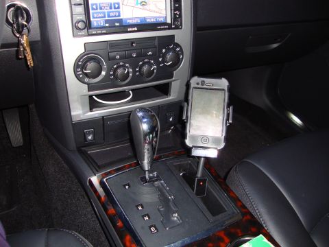 2008 Chrysler 300 - Interior view of a 2008 Chrysler 300, the center console with an iPhone mount and navigation screen.