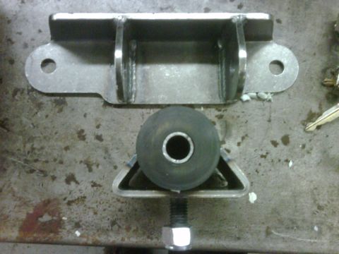1996 Ford Bronco - Close-up of a fabricated motor mount component, likely for a vehicle.