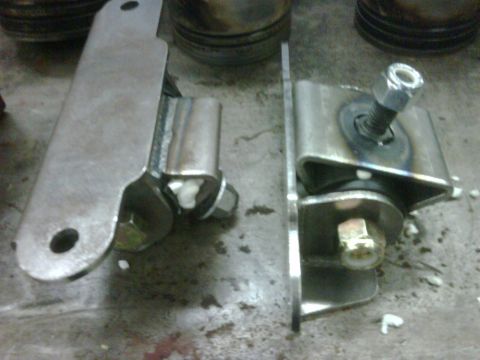 1996 Ford Bronco - Close-up view of two custom motor mounts, likely for an engine swap or repair project.