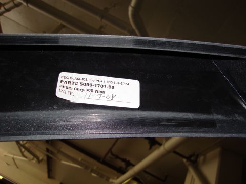 2008 Chrysler 300 - A part for a 2008 Chrysler 300 wing is shown with its identification sticker.