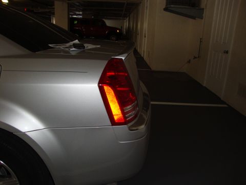 2008 Chrysler 300 - The rear of a silver 2008 Chrysler 300 is shown, its distinctive taillight and trunk lid spoiler.