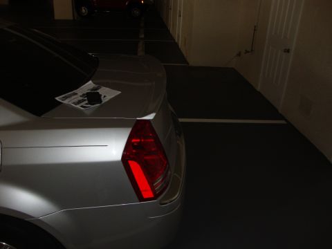 2008 Chrysler 300 - Rear view of a silver sedan with a lip spoiler installed on the trunk.