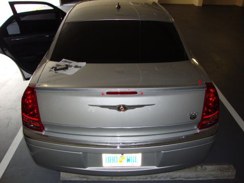 2008 Chrysler 300 - Rear view of a silver Chrysler 300, showing the trunk, taillights, and a spoiler.