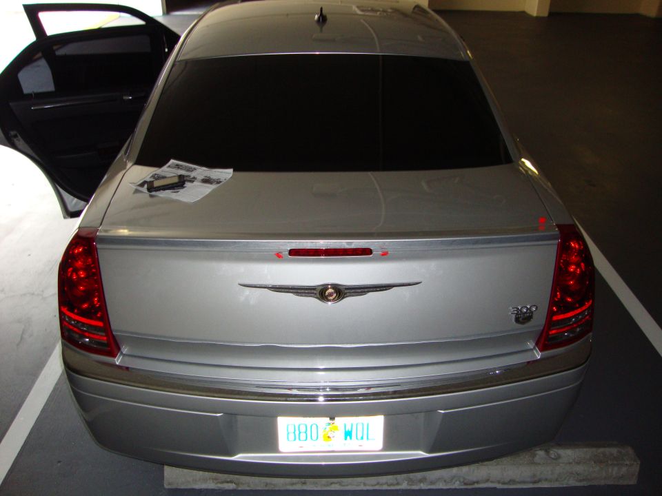 Silver Chrysler 300 rear with spoiler and 300 badge