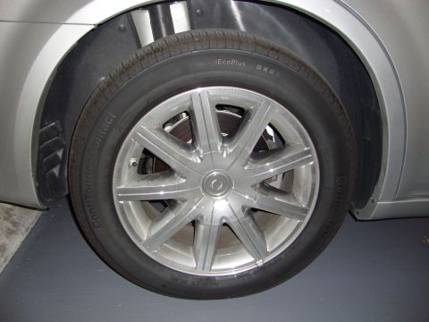 2008 Chrysler 300 - Close-up of a silver alloy wheel and tire on a silver vehicle.