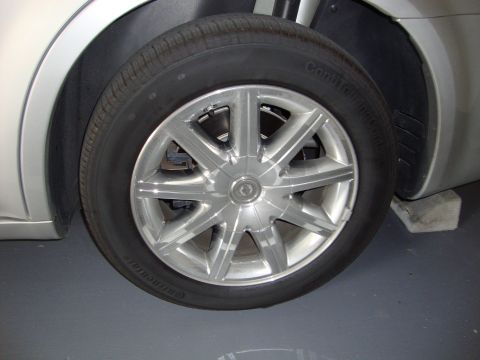 2008 Chrysler 300 - Close-up of a silver alloy wheel and tire on a vehicle.