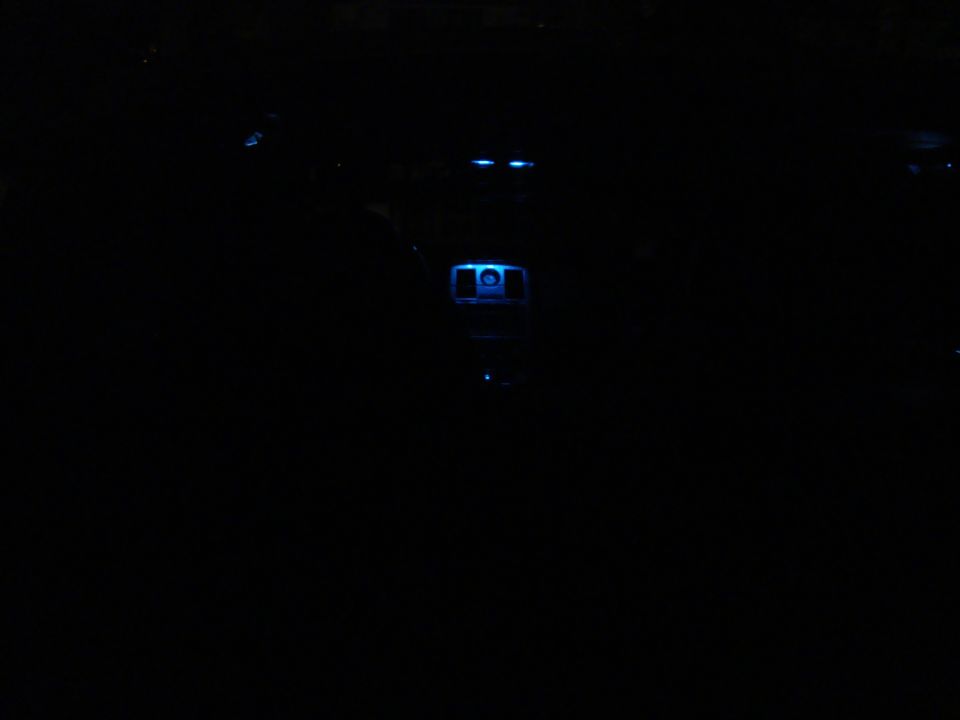 car interior with blue lights on dashboard