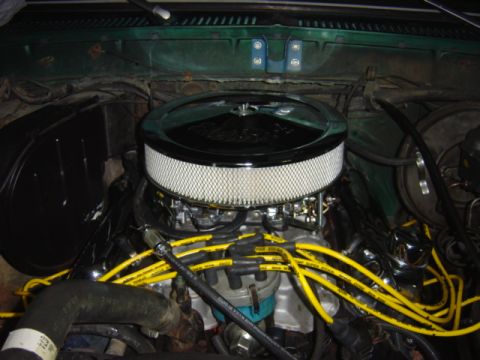 1979 Ford Bronco - Close-up view of an engine bay, highlighting the air filter and spark plug wires.