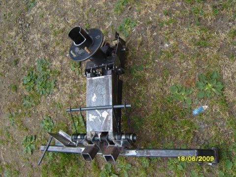 1989 Ford Bronco - A custom-fabricated trailer hitch assembly, possibly for a truck or SUV, is shown outdoors. The assembly has a visible marking of "70/15" a…