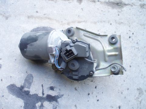 1993 Ford Probe - Windshield wiper motor assembly shown on a concrete surface. Part number visible on motor housing.