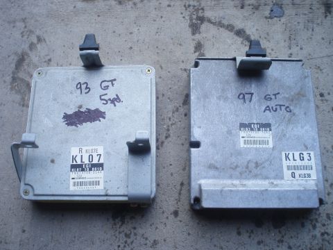 1993 Ford Probe - Two engine control units are shown, one marked for a 1993 manual transmission and the other for a 1997 automatic.