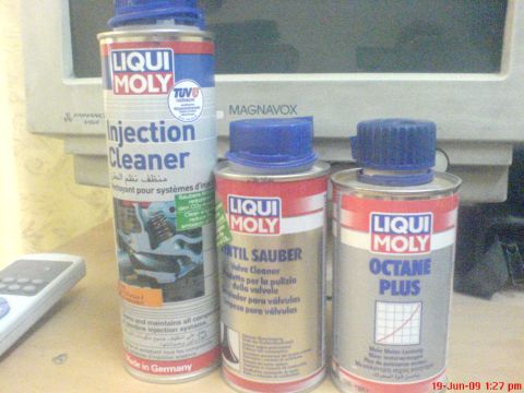1992 Ford Crown Victoria - A collection of Liqui Moly automotive maintenance products, including injection cleaner and octane booster, are displayed on a surface.