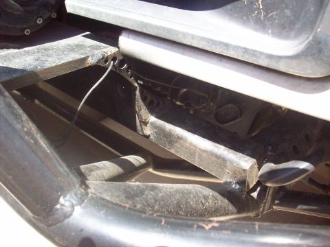 1995 Ford Bronco - A close-up view of the vehicle's undercarriage reveals its frame and suspension components.