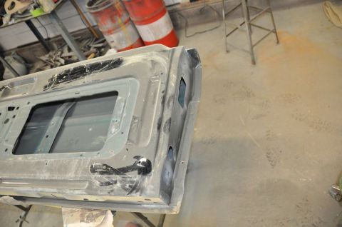 1996 Ford Bronco - This is a car tailgate, likely undergoing repair or restoration, with its window removed.