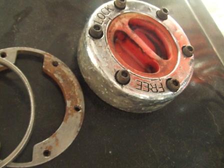 1996 Ford Bronco - A free-wheel hub lock mechanism is shown, with the 'LOCK' and 'FREE' settings clearly marked.