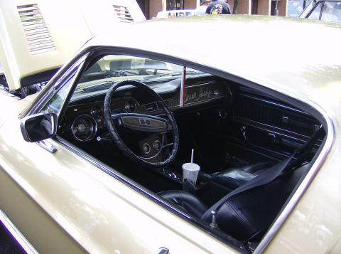 1970 Ford Ranchero - The interior of a 1968 Shelby GT500 features wood grain accents and a prominent "Shelby" script on the dashboard.