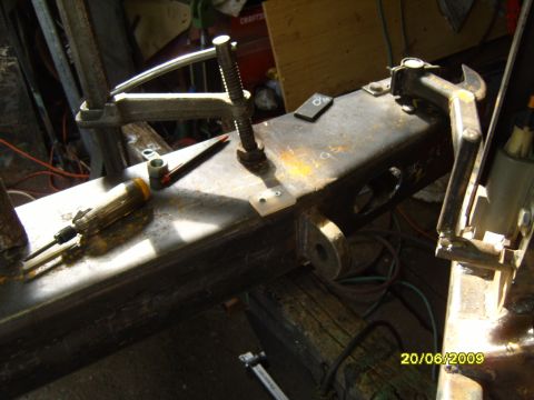 1989 Ford Bronco - Close-up of a metal frame with tools, possibly part of a vehicle repair or fabrication project.