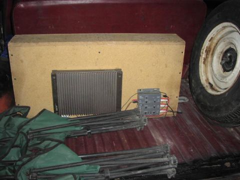 1981 Ford Bronco - Audio equipment and a spare tire are visible in the cargo area of a vehicle.