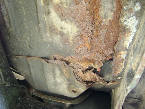 1979 Ford Bronco - Severe rust damage is visible on this vehicle's undercarriage frame.