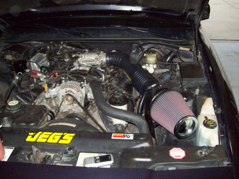 1999 Mercury Grand Marquis - Aftermarket K&N air intake system installed in an engine bay, a JEGS sticker on the radiator support.