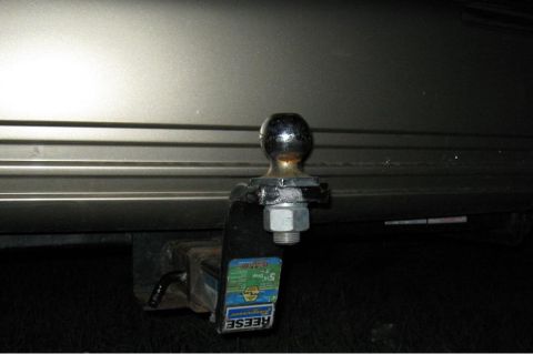 2000 Mercury Grand Marquis - Close-up of a trailer hitch ball mount attached to a vehicle's frame.