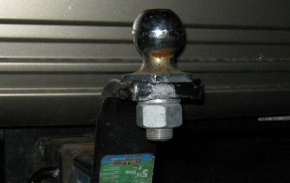 Trailer hitch ball with a 5/16 inch drop indicated on a label
