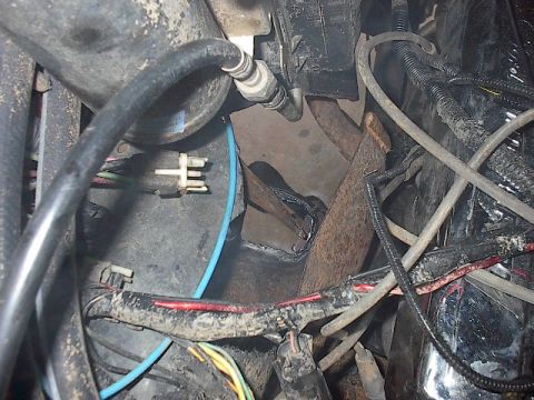 1986 Ford Bronco - Here is the passanger front with the hole cut to pass the shock through.