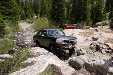 1993 Ford Bronco - Off-roading adventure in the mountains with a 1993 Ford Bronco tackling challenging terrain.