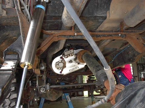 1986 Ford Bronco - Upper mount needed to be removed and turned down to accept the Bilstien heim joint on top. You can also see exhaust routing on this pic.
