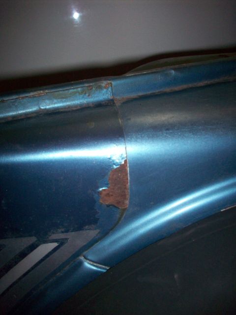 1978 Jeep CJ5 - Rust is forming on the seam of this blue vehicle's body panel.
