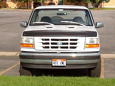 1995 Ford Bronco - This 1995 Ford Bronco is shown from the front, with its grille and headlights clearly visible.